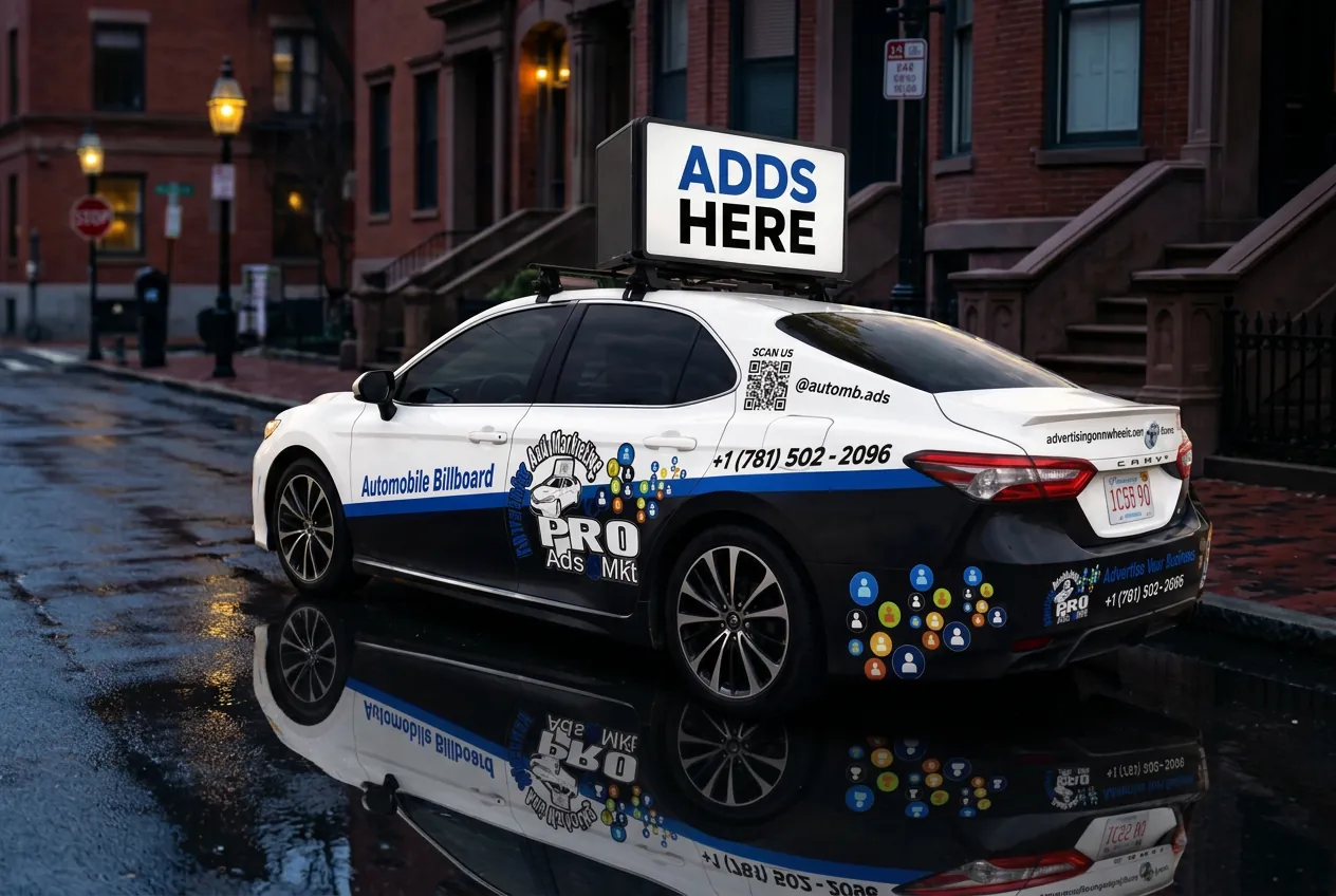 The real Boston Mobile Billboard car on a downtown Boston street at dusk, rooftop ad display visible